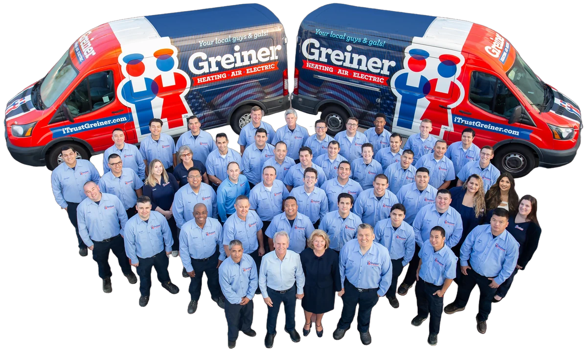 The Greiner Heating, Air and Electric team with two Greiner vans